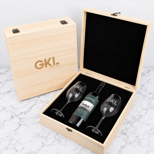 Personalised corporate wine gift set with two engraved 360ml wine glasses, wine bottle and company logo on a wooden presentation box.