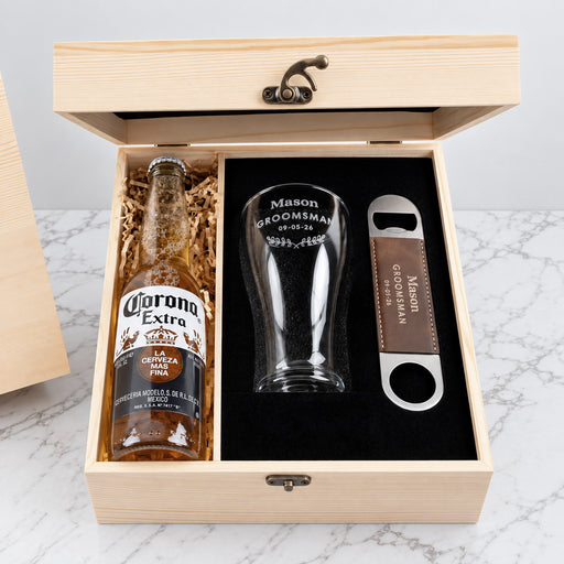 Engraved groomsmen beer set personalised with name, wedding title and date, presented in a wooden gift box.