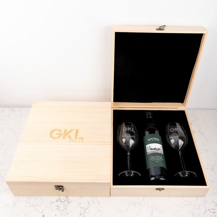 Corporate gift idea featuring premium wine glasses, personalised wooden box, and choice of red or white wine