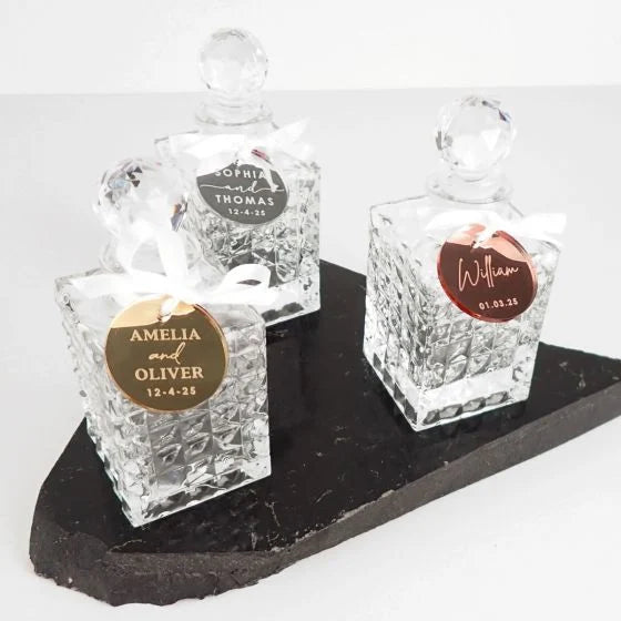 Mini decanter wedding favours with attached engraved personalised acrylic gift tag