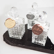 Mini decanter wedding favours with attached engraved personalised acrylic gift tag