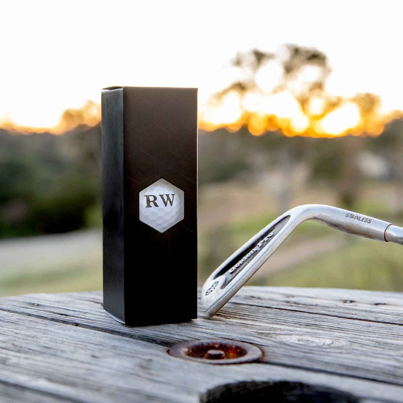 Gift boxed golf balls with bold black personalised initials